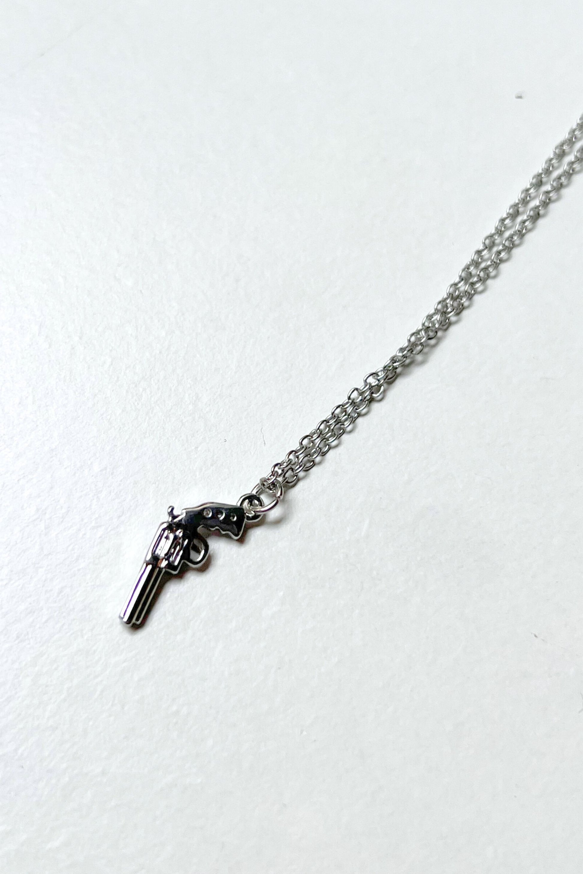 collier gun argent midnite acier inoxydable homme femme bijoux festival techno party summer ete 2026 bijoux chaine