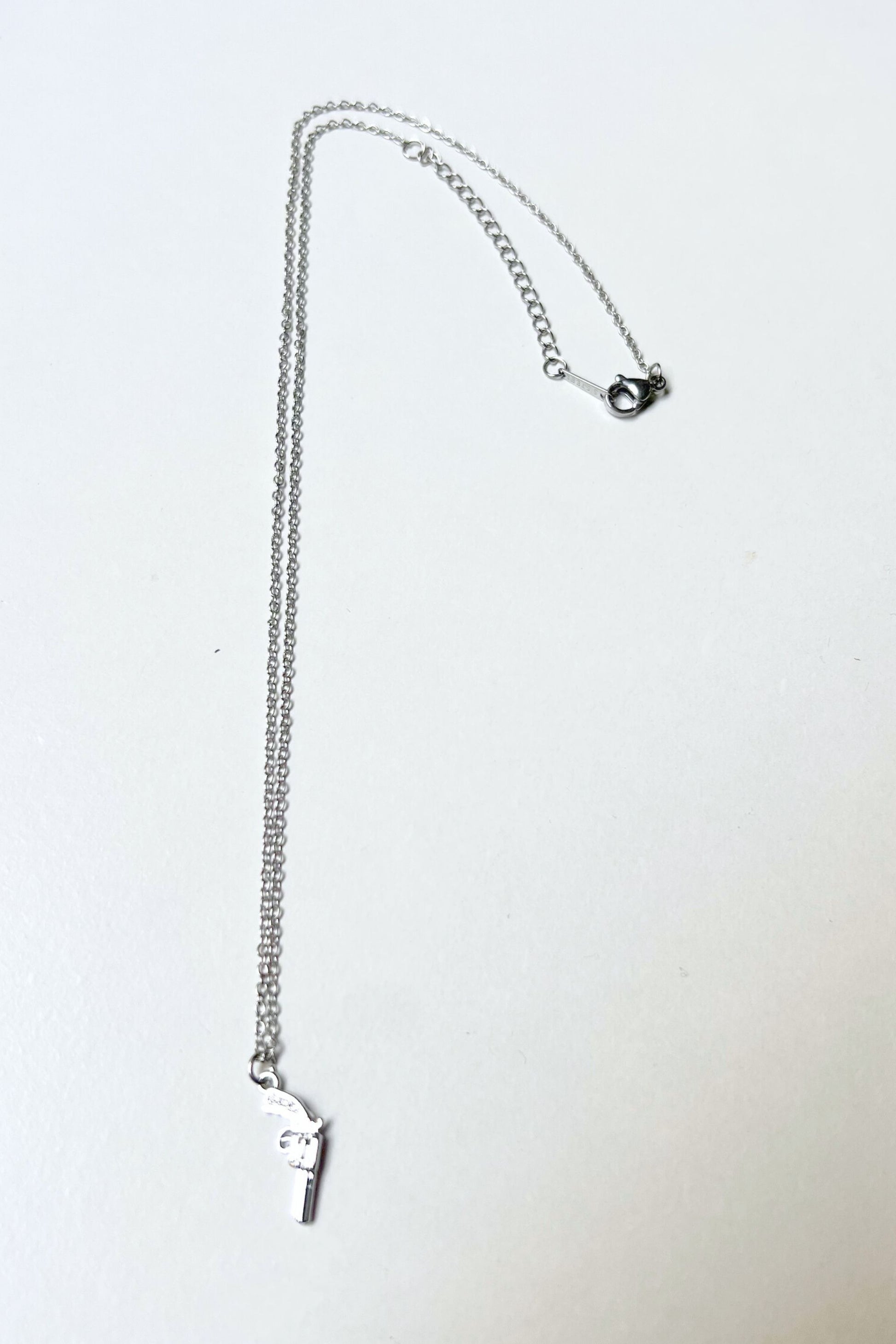 collier gun argent midnite acier inoxydable homme femme bijoux festival techno party summer ete 2026 bijoux chaine